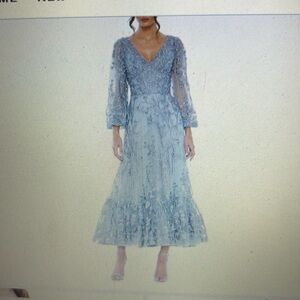 Brand new Mac Duggal dress. Seafoam bluish green, long sleeves.